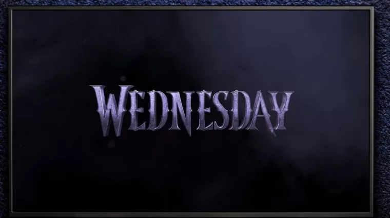 TV on black wall. TV screen playing Wednesday trailer or movie. Moscow^ Russia - December 5^ 2022.