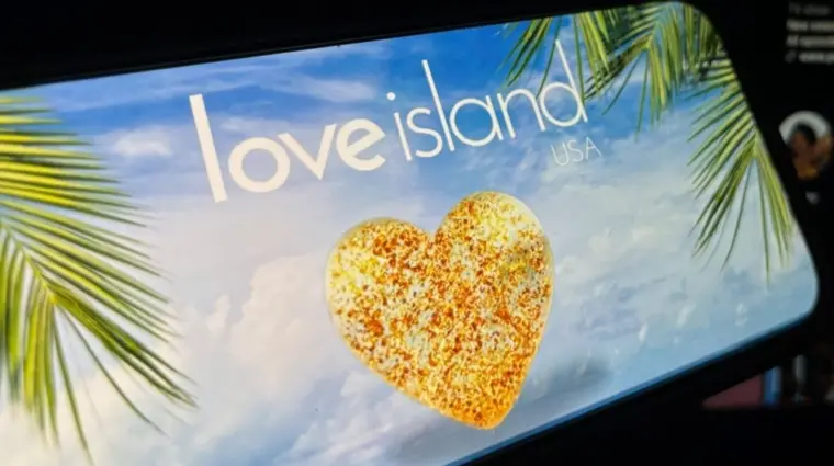 '2025 Love Island'' shown on a smart phone. is a reality dating show that originated in the UK. The premise involves a group of singles living together in a luxurious villa^ where they couple up Toronto^ Canada - June 5