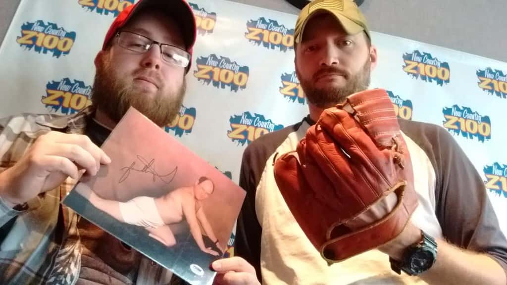 My friend Greg Poole with an autographed, unique", picture of acotr Jason Alexander from TV's Seinfeld. And, I've got a Micky Mantle 1959 baseball glove. 