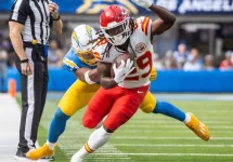 KC Chiefs running back Kareem Hunt #29 runs past LA Chargers linebacker Daiyan Henley #0 during an NFL football game at SoFi Stadium^ Aug. 17^ 2024^ in Inglewood^ Calif.