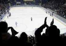 hockey fans applaud at ice hockey stadium
