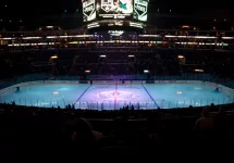 pro ice hokey rink lit up at nighttime