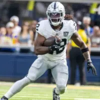 Las Vegas Raiders running back Alexander Mattison #22 runs the ball against the Los Angeles Rams in an NFL football game at SoFi Stadium^ Oct. 20^ 2024^ in Inglewood^ Calif.