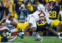 Alabama wide receiver Isaiah Bond (R)is tackled during the 2024 Rose Bowl game Monday^ Jan. 1^ 2024^ in Pasadena^ Calif.
