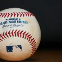 Major League Baseball (MLB) Baseball on black background