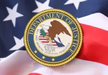 US Department of Justice seal on United States of America flag close up
