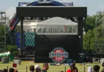 WASHINGTON^ DC - June 7^ 2026: Tourists look on the Ultimate Fighting Championship's octagon set up on the White House South Lawn for an event scheduled for June 14.