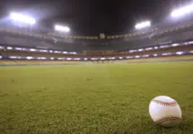 Selective focus of baseball in outfield grass at Dodger Stadium Los Angeles - October 12^ 2022