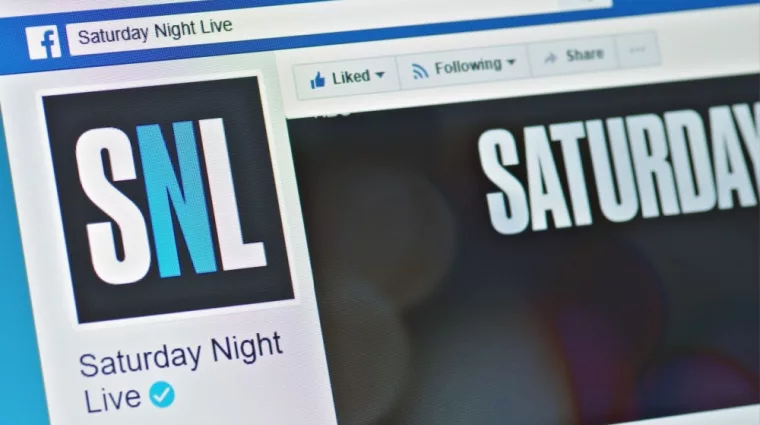 A computer screen shows details of Saturday Night Live page on Facebook web site. Selective focus.