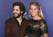 Thomas Rhett (L) and wife Lauren Akins attend the 2019 CMT Artists of the Year at Schermerhorn Symphony Center on October 16^ 2019 in Nashville^ Tennessee.