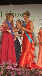 Yotter (left) is crowned by last year's fair queen, Andrea Larson (right).