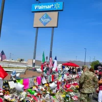 Flowers^ posters^ toys and other memorabilia left for the victims of the Walmart shooting on 3 August 2019. El Paso^ Texas / USA - August 2019