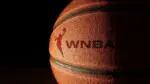 Closeup of a basketball with the WNBA logo and text Raleigh^ NC - USA - 06-13-2024