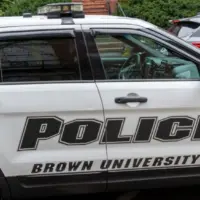 A police car in Brown University campus in Providence^ RI^ USA^ on November 10^ 2023. Brown University is a private Ivy League research university in Providence^ Rhode Island.