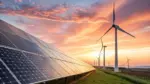 Solar panels and wind turbines stand tall under a dramatic sunset sky^ symbolizing clean renewable energy and a sustainable future landscape against a vibrant golden hour light.