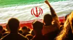 Defocus protest in Iran. Conflict war over border. World crisis. Country flag. Woman low rights. Male hands. Out of focus.