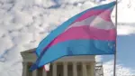 A transgender pride flag flies in front of the U.S. Supreme Court building in Washington^ DC.