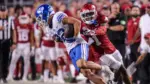 NCAA Football^ BYU 38:31 Ark- Cougars WR Parker Kingston (82) catches a pass fights off Razorbacks DB Lorando Johnson (1) the game at Razorback Stadium^ Fayetteville^ AR. Sept 16^ 2023