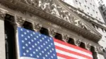 Grand American flag displayed on the facade of the New York Stock Exchange in downtown Manhattan. New York^ NY^ USA - 11.05.2024