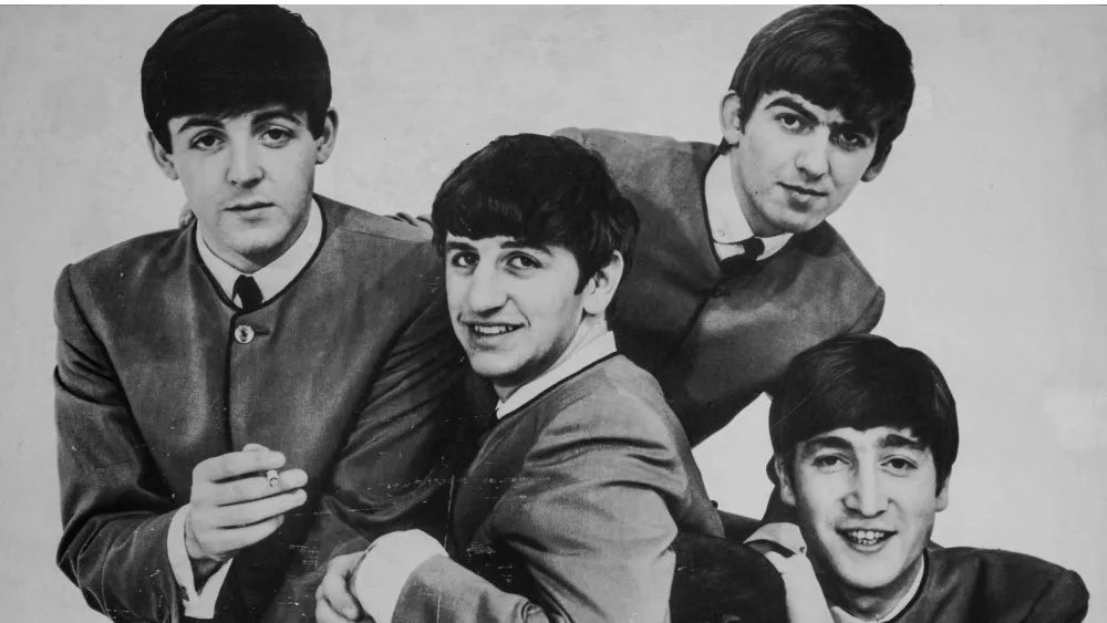 Vintage photo Portrait of The Beatles musical band group. Old textured vintage black and white photograph 1960s-70s