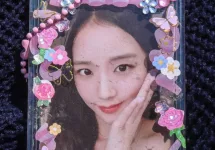 Photocard of girl group singer Kim Ji Soo or Jisoo of Blackpink. photocard of Jisoo blackpink isolated on blue background.