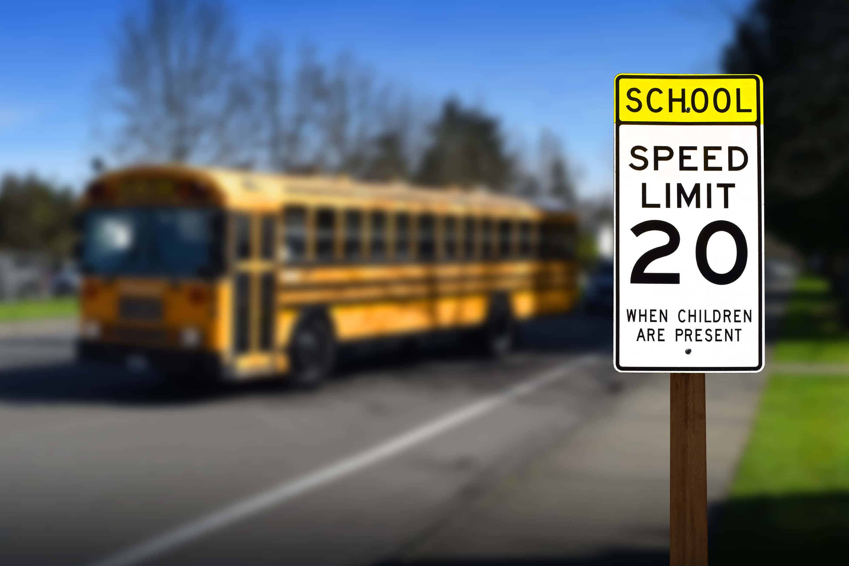 school-zone-speed-limit-sign-with-bus