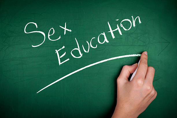 woman-hand-writing-sex-education-on-green-blackboard