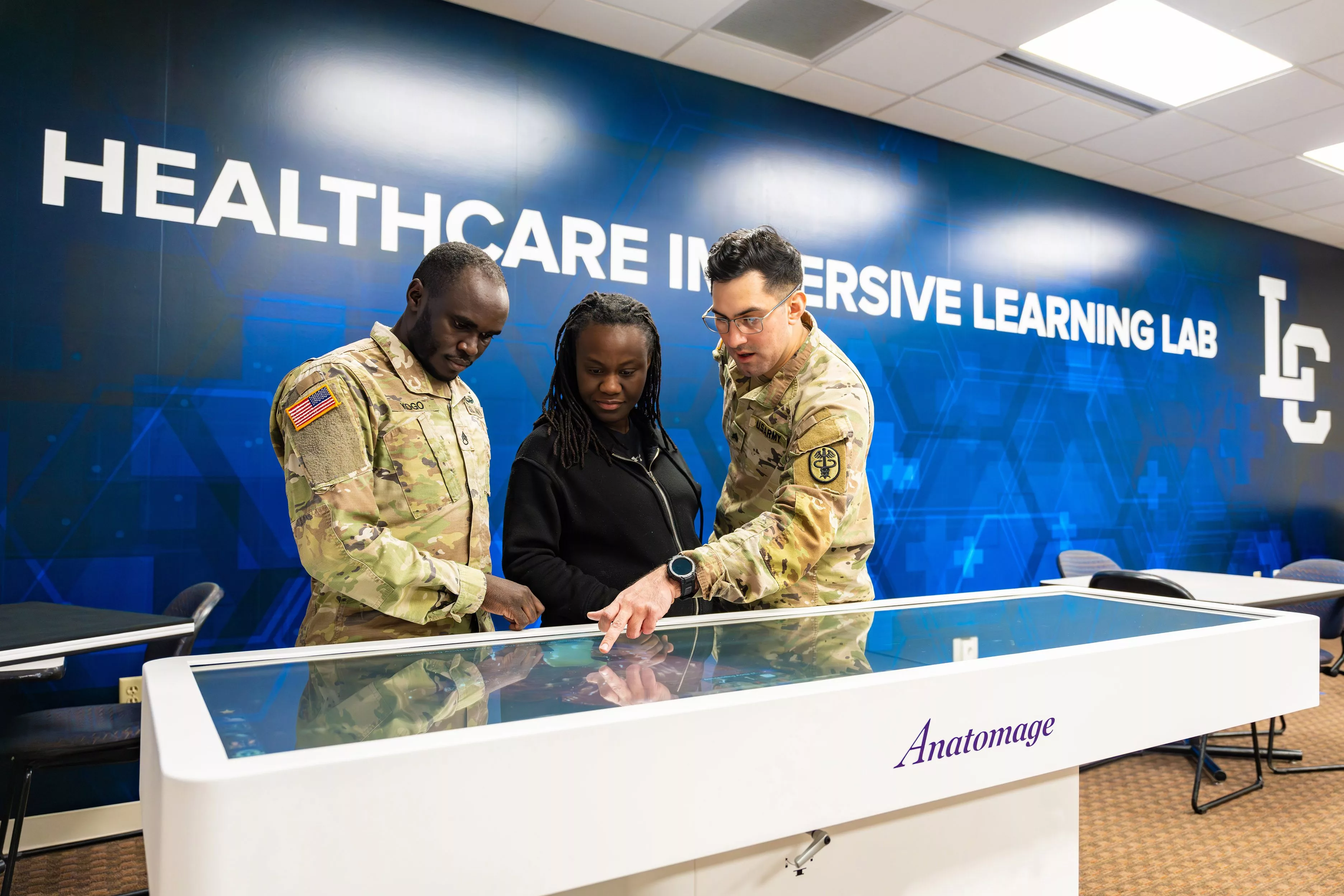 active-duty-nursing-students-mark-kogo-shnightdine-aristil-and-andrew-hunt-in-healthcare-immersive-learning-lab