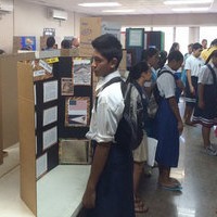 Students touring classrooms and viewing the projects of their peers.