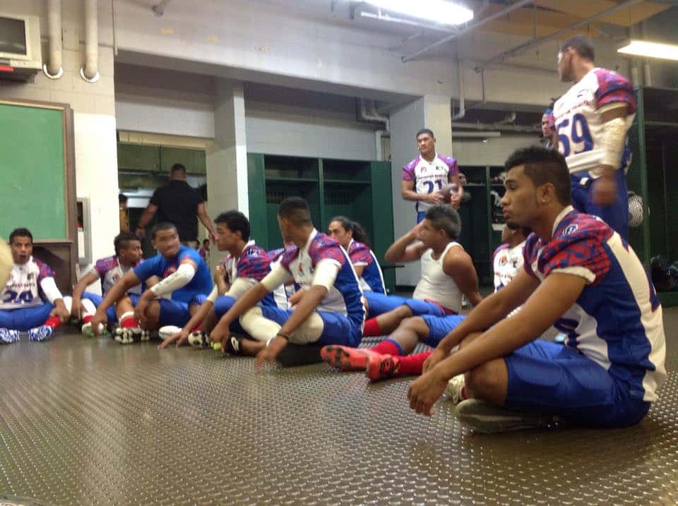 as footballers sitting