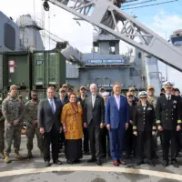 aboard-the-uss-gunston-hall-in-2022-with-colleagues-and-navy-personnel