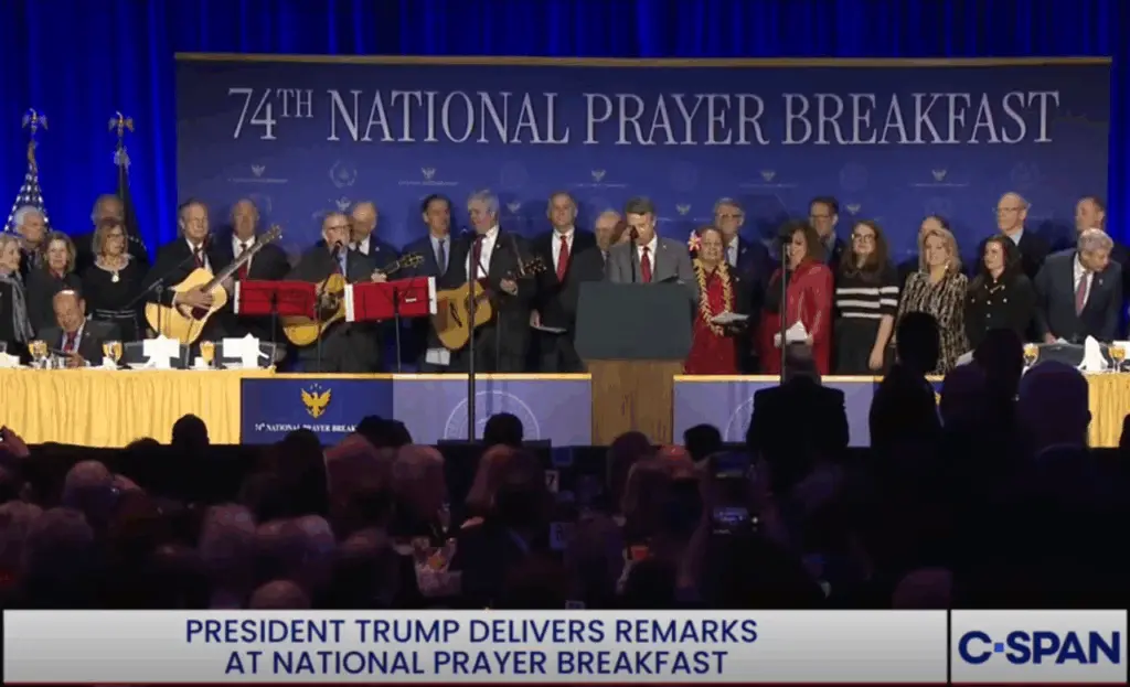prayer-breakfast-members-choir-with-congresswoman-amata-near-the-center-podium