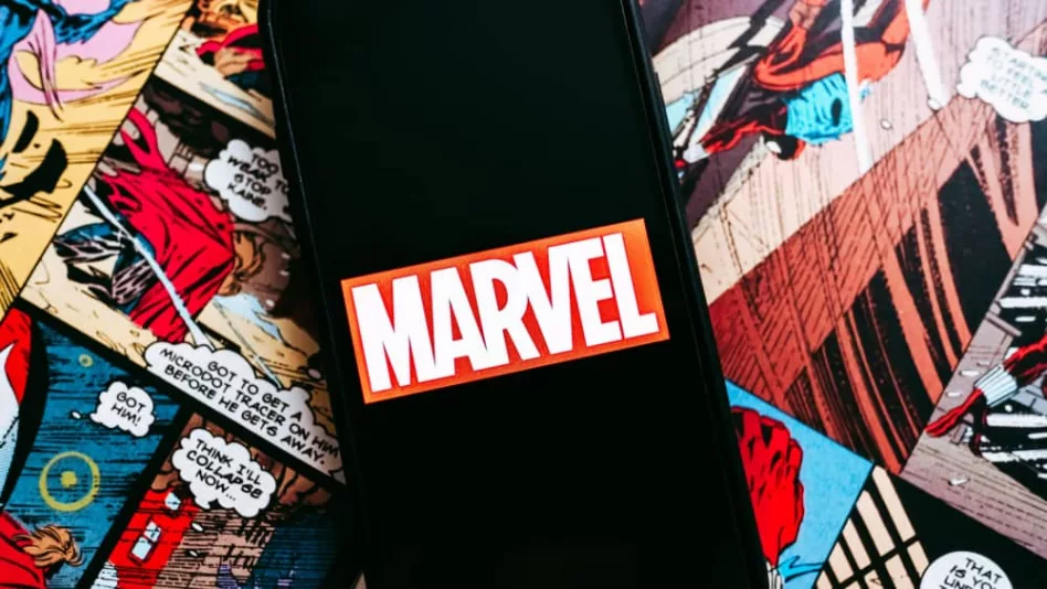 Marvel comics logo on the background of comic pages