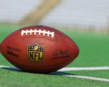 NFL football on grass turf background