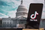 TikTok sign is sharp in the foreground^ while American Congress building is blurred in the background^ concept for TikTok ban in the United States^ USA^ March 8^ 2024