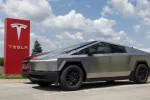 Tesla Cybertruck display at a dealership. Tesla claims the Cybertruck has a driving range of up to 340 miles. Indianapolis - May 19^ 2024: