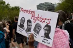Demonstrators gather during a protest in front of the White House in Washington^ DC^ on April 19^ 2025.