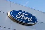 Closeup of the Ford logo seen at a Ford dealership store in Sunnyvale^ California. Ford Motor Company is an American multinational automobile manufacturer. Sunnyvale^ CA^ USA - Nov 22^ 2023