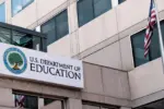 The exterior sign and US flag in front of the U.S. Department of Education offices in Washington^ DC. Washington^ DC USA; September 5^ 2024