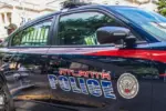 Atlanta police car and officer on cellphone Atlanta^ Ga USA - 06 07 20