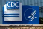Closeup of the CDC logo seen at the Edward R. Roybal campus^ the headquarters of the Centers for Disease Control and Prevention (CDC) in Atlanta^ Georgia.
