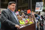 Protests in downtown Chicago after overturning of Roe v. Wade^ Governor of Illinois^ J. B. Pritzker^ talking to protester in support Chicago^ Illinois - June 24 2022