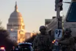Members of the National Guard patrol the area surrounding the outskirts of the Capitol Building on January 19^ 2021^ in Washington D.C.