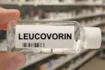 Bottle of LEUCOVORIN tablets on a hospital pharmacy table used to reduce methotrexate toxicity a folinic acid supplement.
