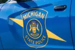 State of Michigan police coat of arms on squad car Dimondale MI - June 4^ 2022