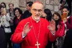 Cardinal Pierbattista Pizzaballa^ Latin Patriarch of Jerusalem^ greets the crowd as he leaves the Church of the Nativity after the Christmas celebrations. Bethlehem^ West Bank^ December 25^ 2025