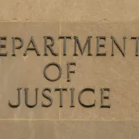 Sign "Department of Justice" on the Facade of the DoJ Building Washington^ DC^ USA - 16 July 2021