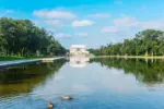 World famous Lincoln Memorial reflected in the water under a cloudy sky. Washington D.C.^ USA