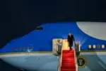 President Donald Trump arrives at Palm Beach aboard Airforce One at night. Red carpet stairs Palm Beach International Airport. 2026 January 1