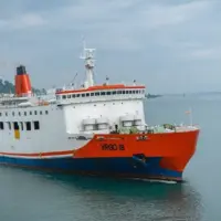 Merak^ 22 February 2026 Passenger ferry crossing the Sunda Strait connecting Java and Sumatra^ featuring large roll-on roll-off vessels operating between Merak and Bakauheni under a cloudy sky.